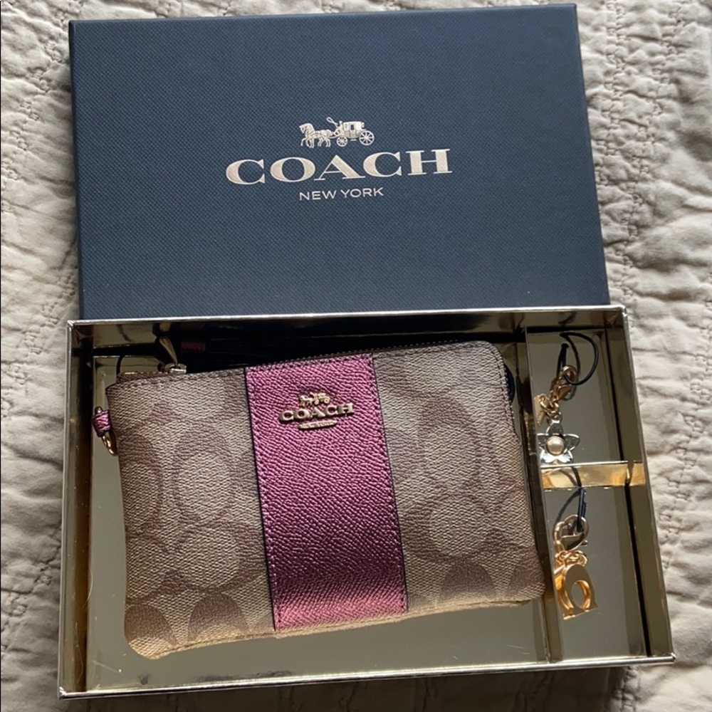 Coach wristlet with extra charms, new in box!